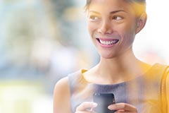 Woman smiling texting