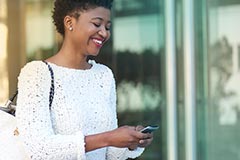 Woman smiling texting